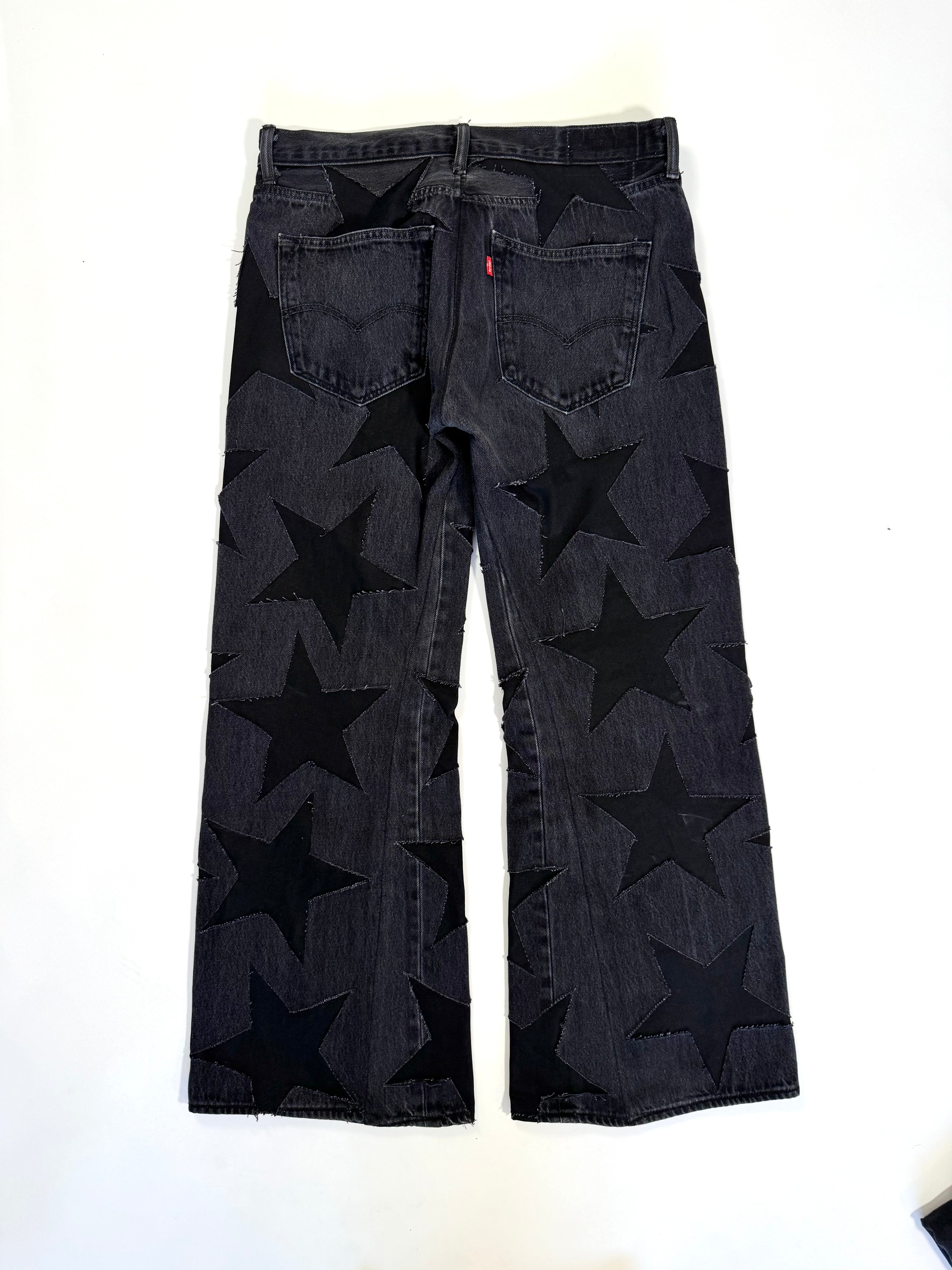 Black on Black All Over Star Jeans (Size 34)