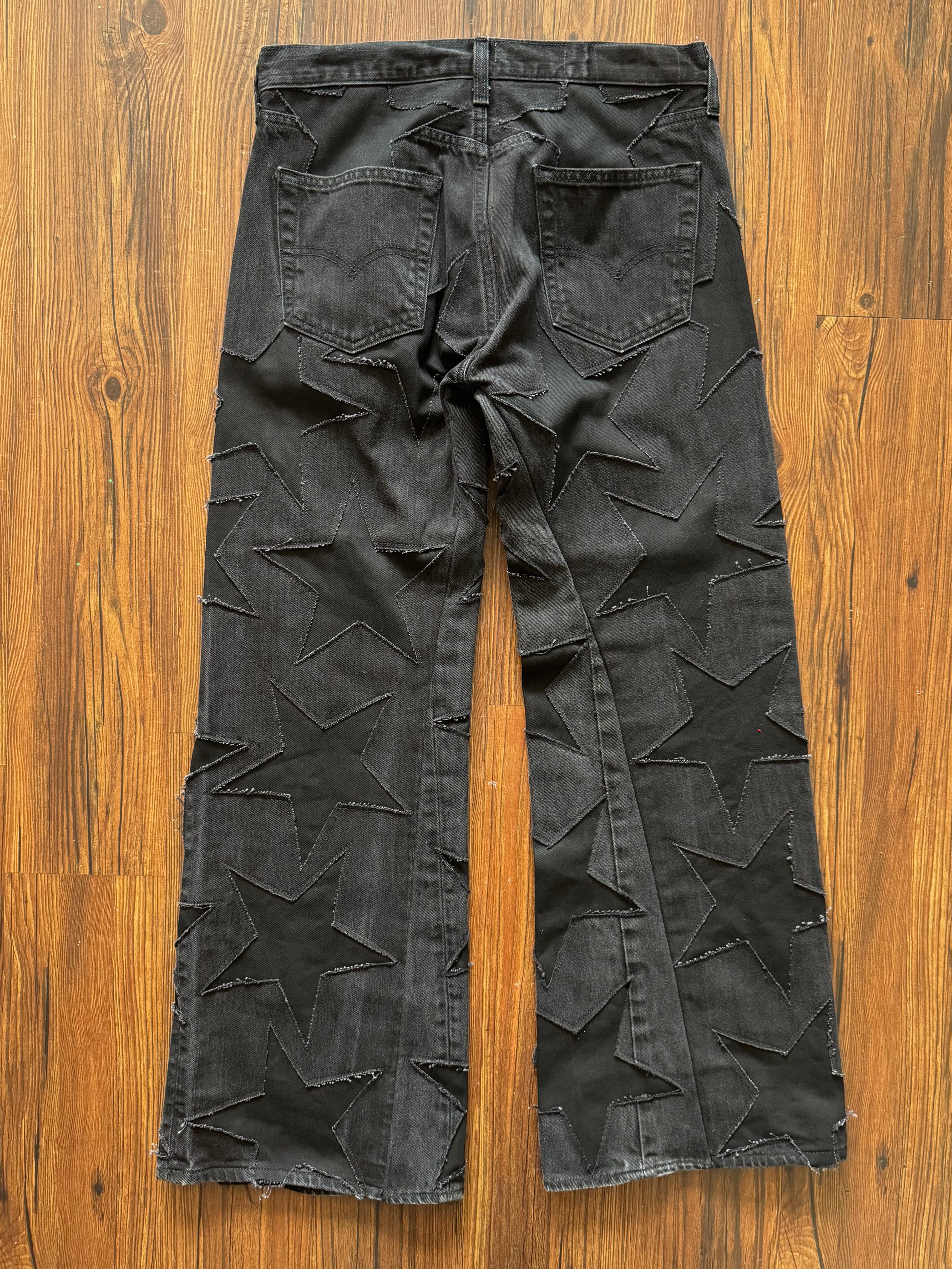 Black on Black All Over Star Jeans (Size 32)