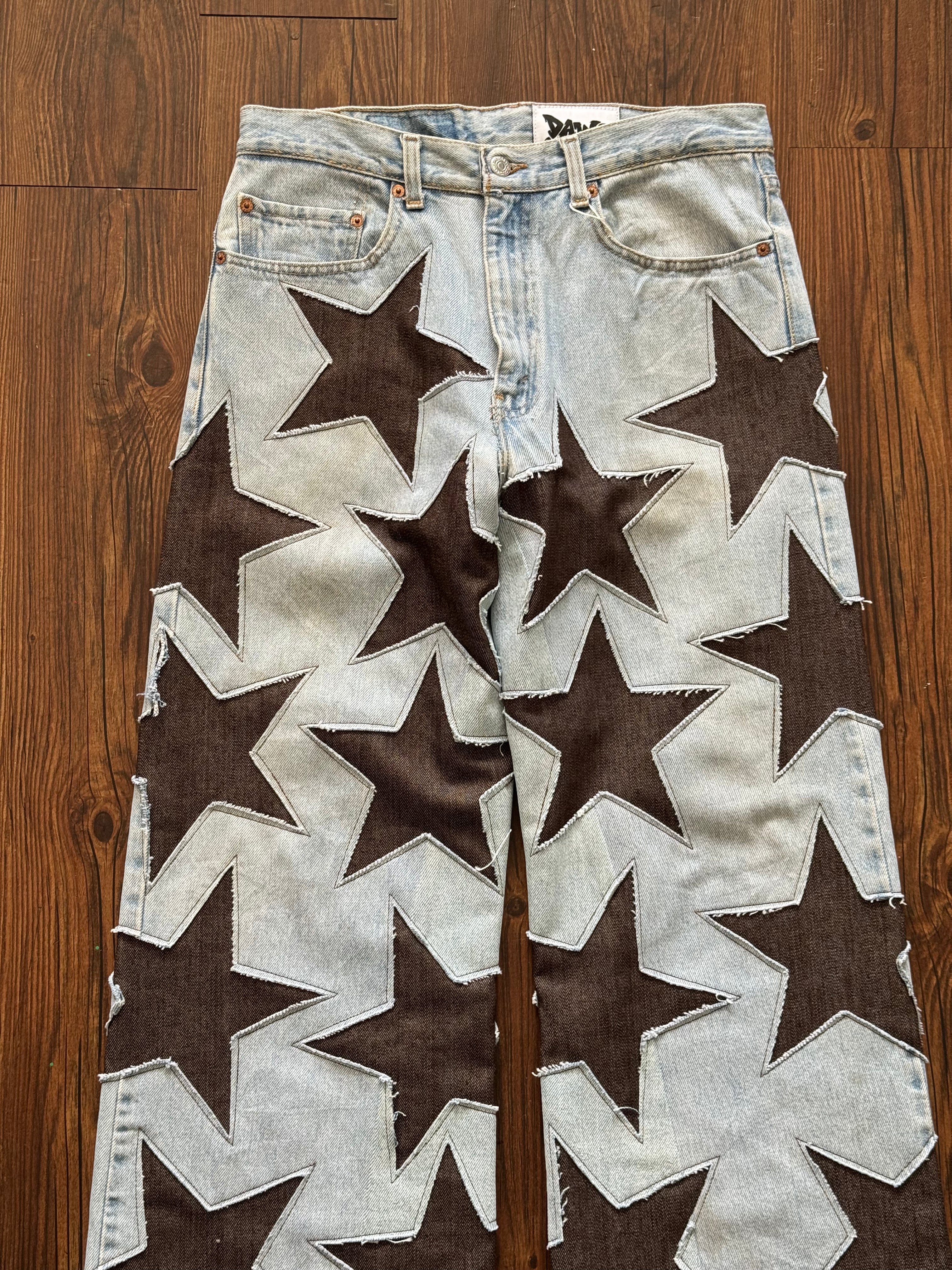 Light Wash Brown All Over Star Jeans (Size 32)