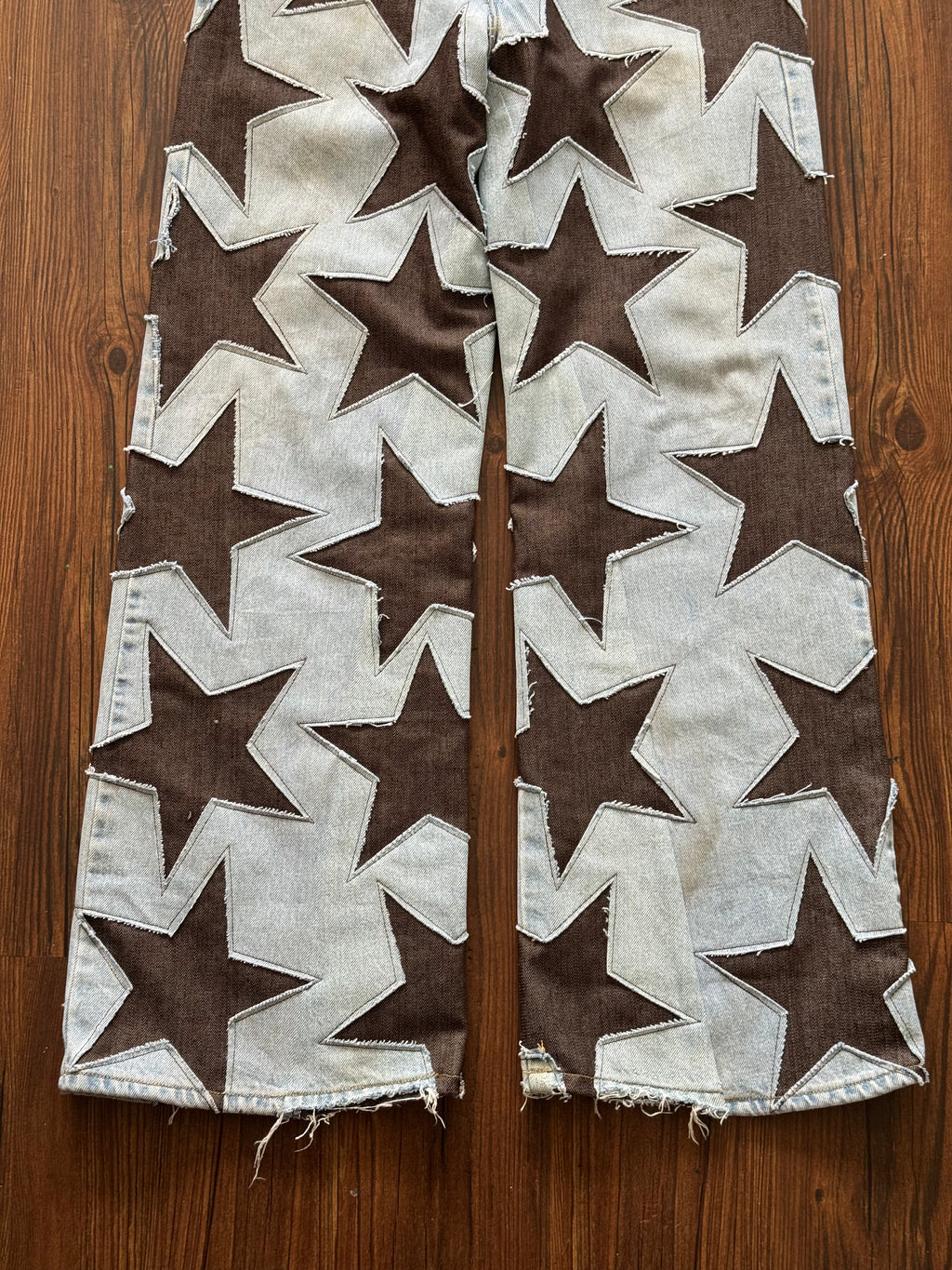 Light Wash Brown All Over Star Jeans (Size 32)