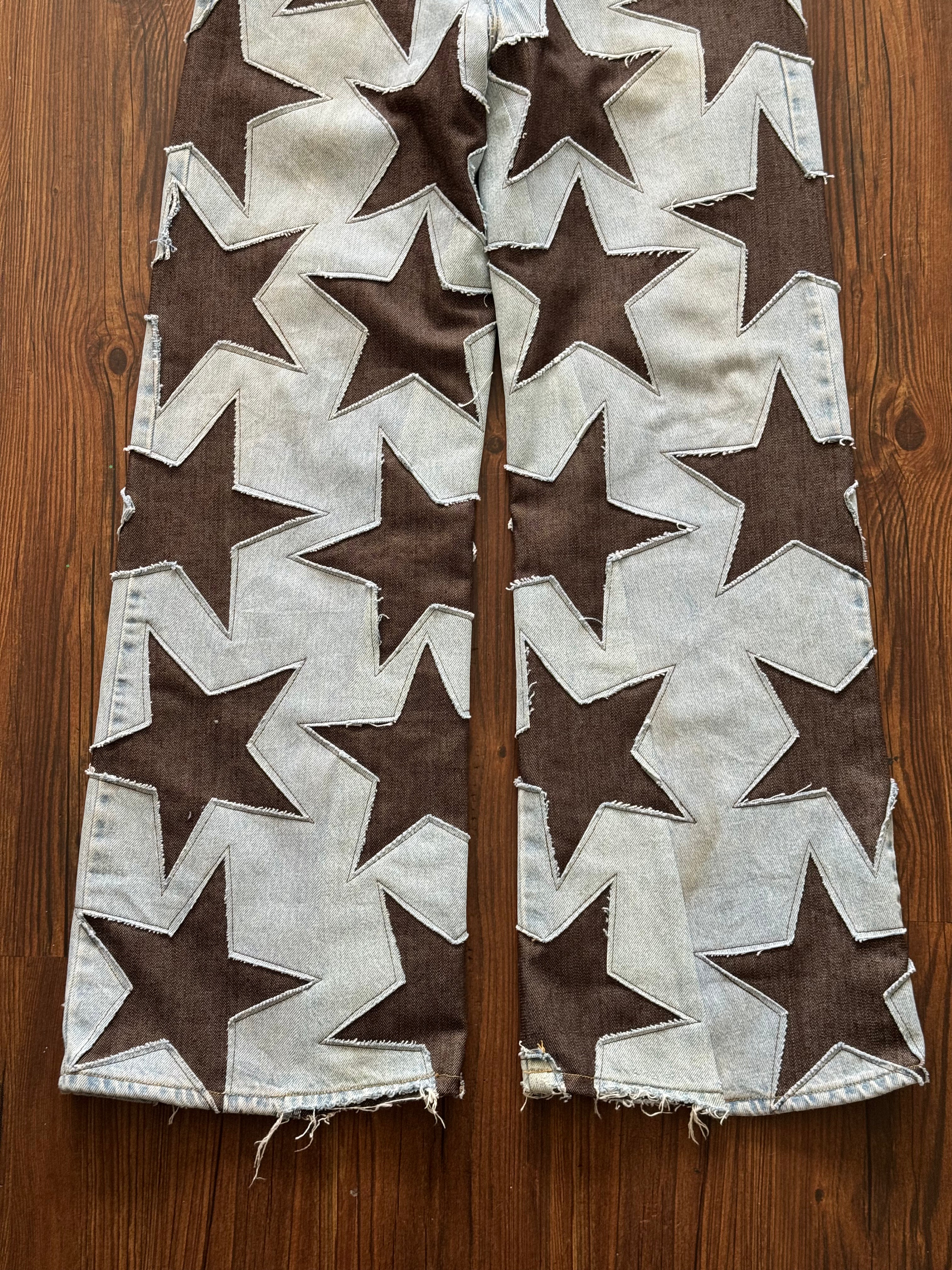 Light Wash Brown All Over Star Jeans (Size 32)