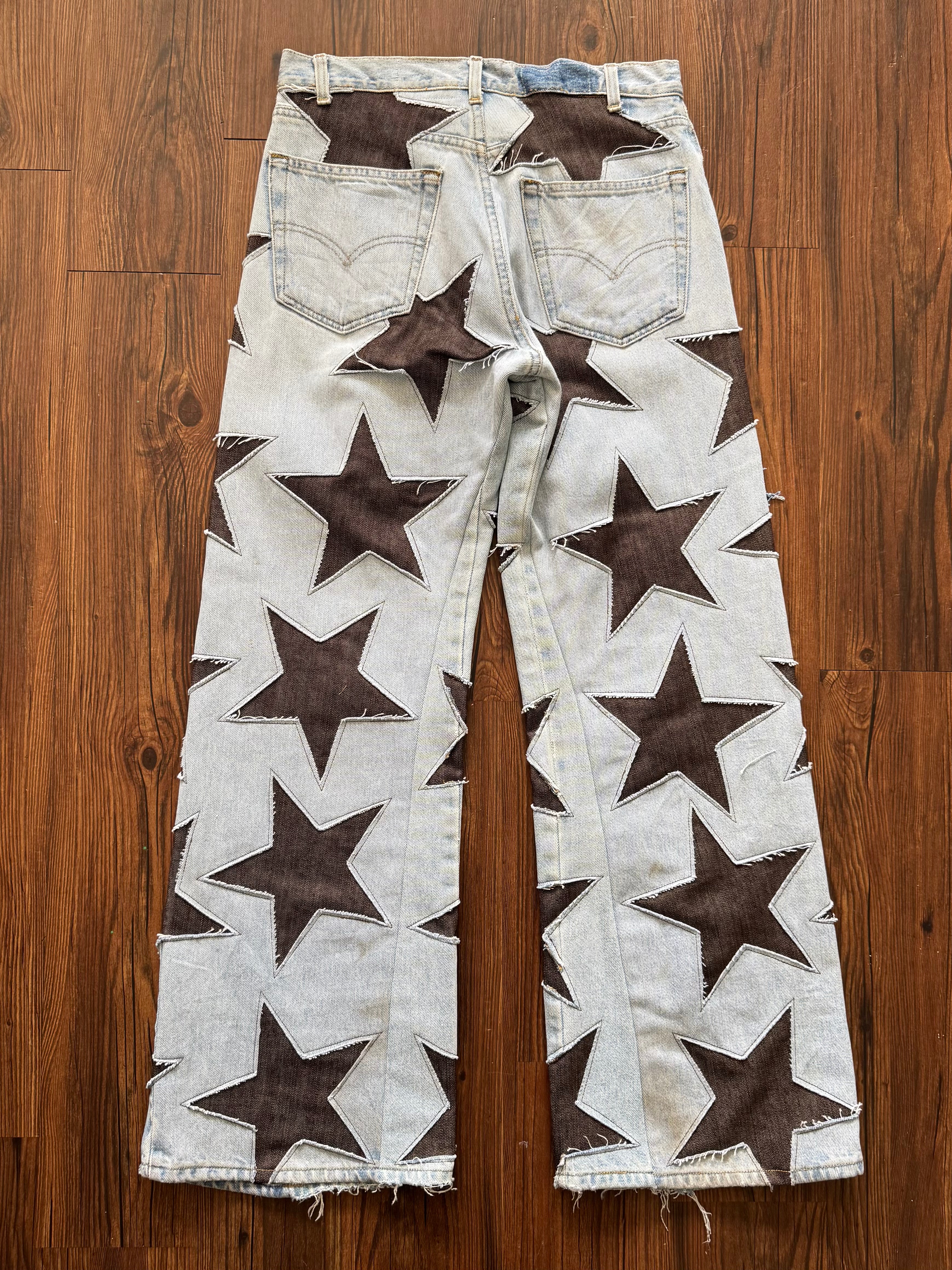 Light Wash Brown All Over Star Jeans (Size 32)
