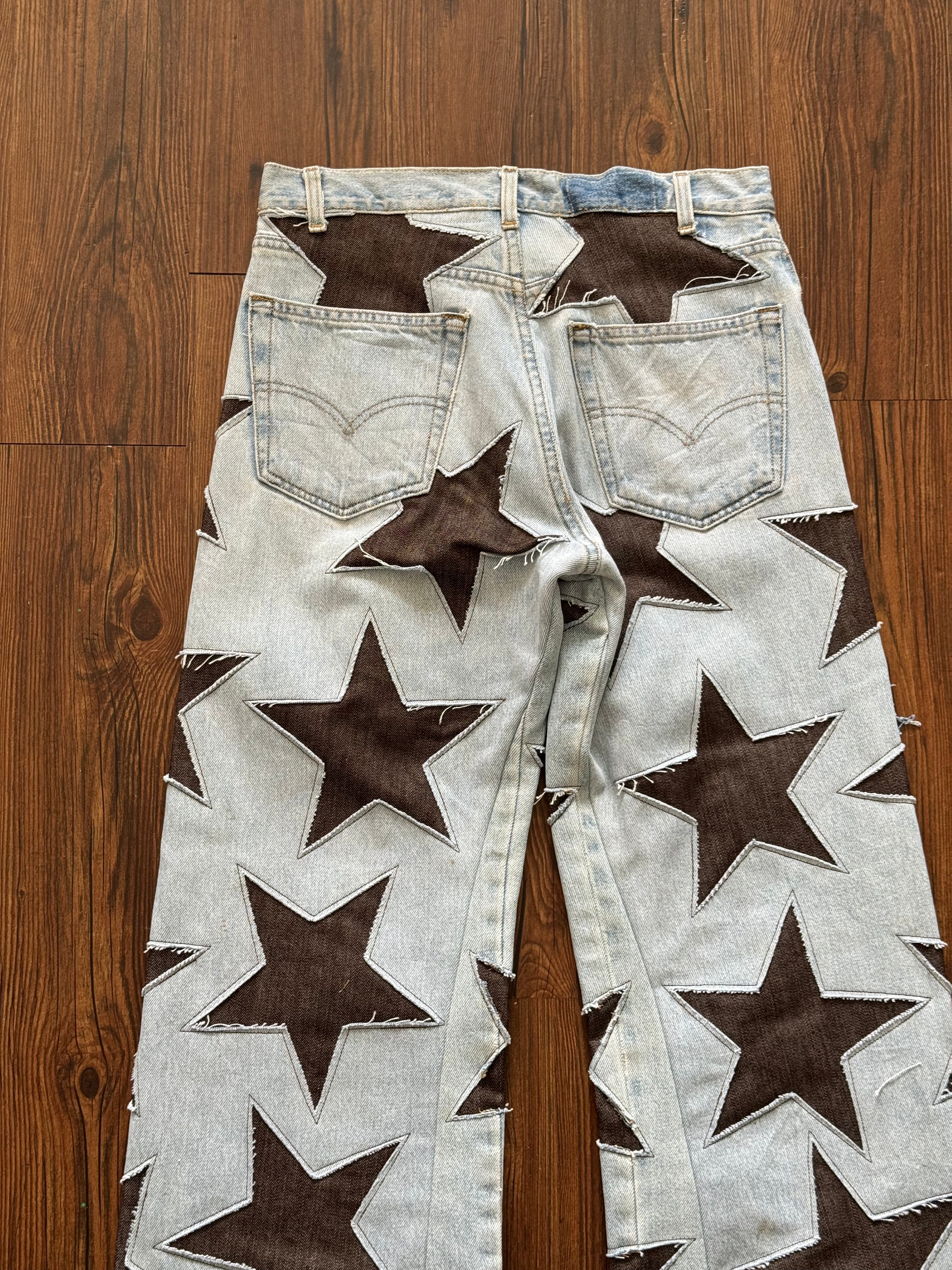 Light Wash Brown All Over Star Jeans (Size 32)