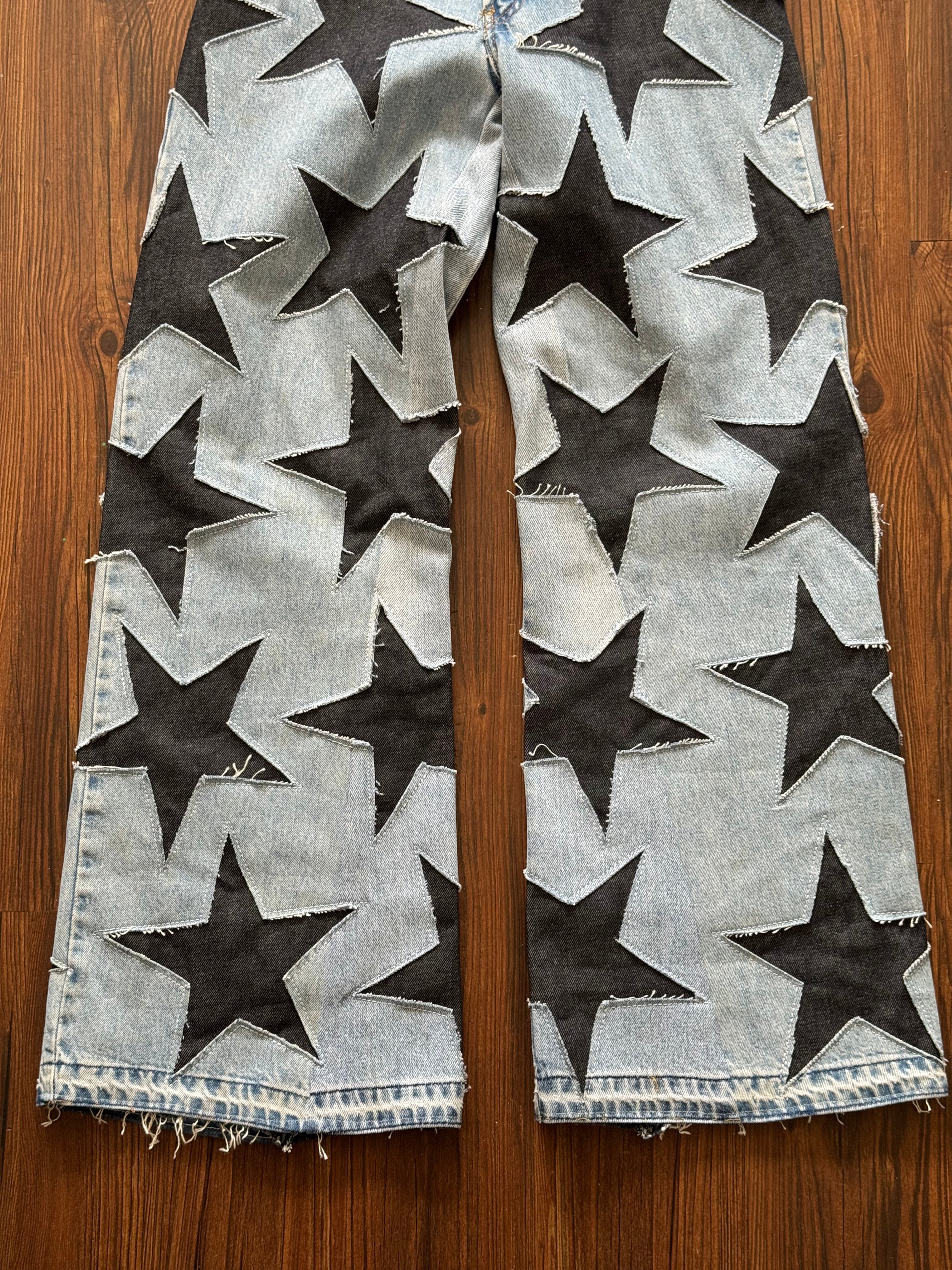 Light Washed All Over Star Jeans (Size 32)
