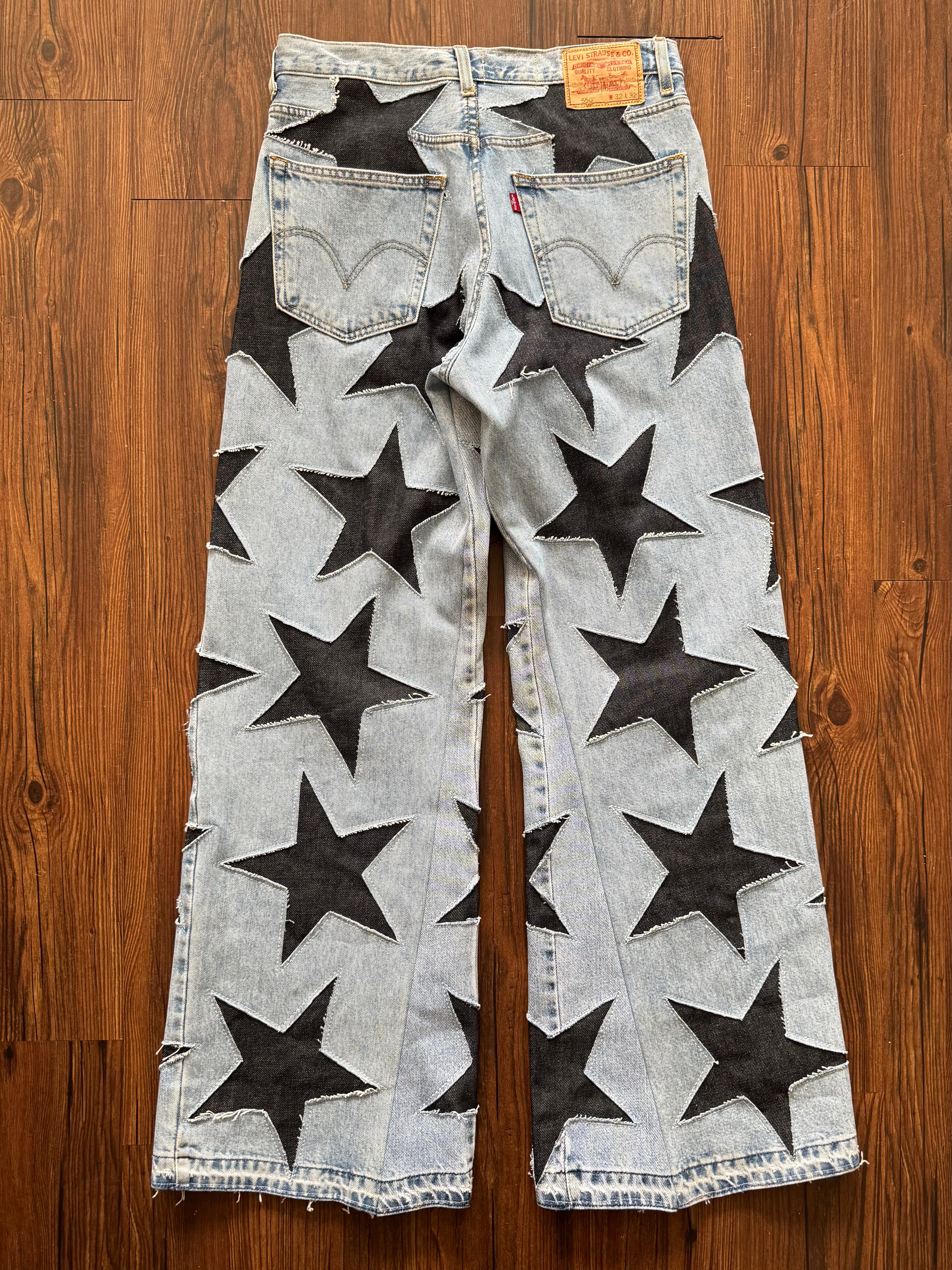 Light Washed All Over Star Jeans (Size 32)