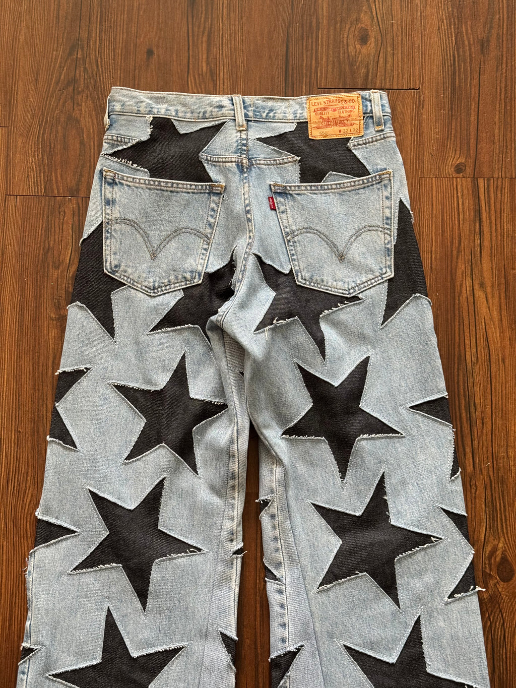 Light Washed All Over Star Jeans (Size 32)