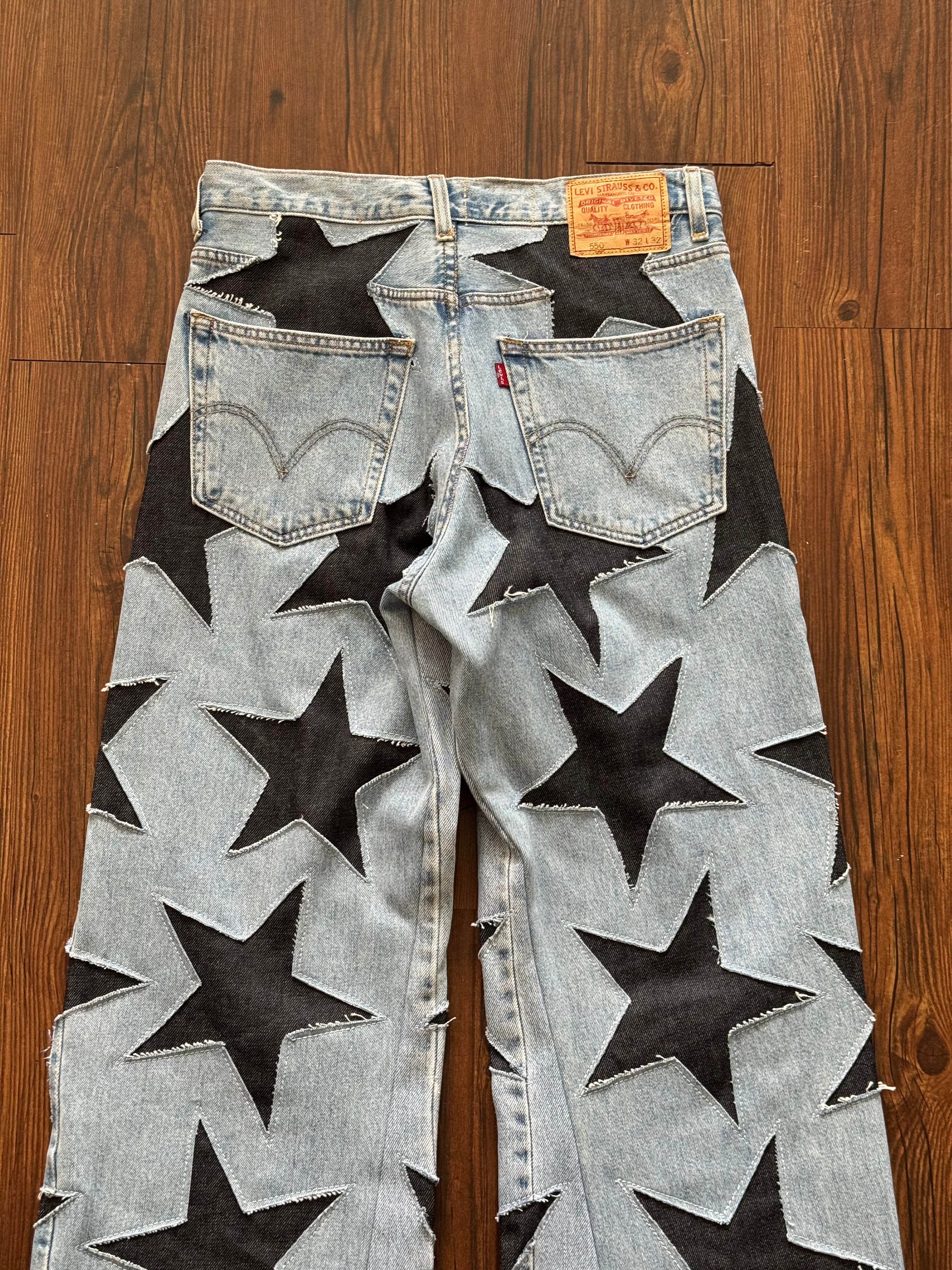 Light Washed All Over Star Jeans (Size 32)
